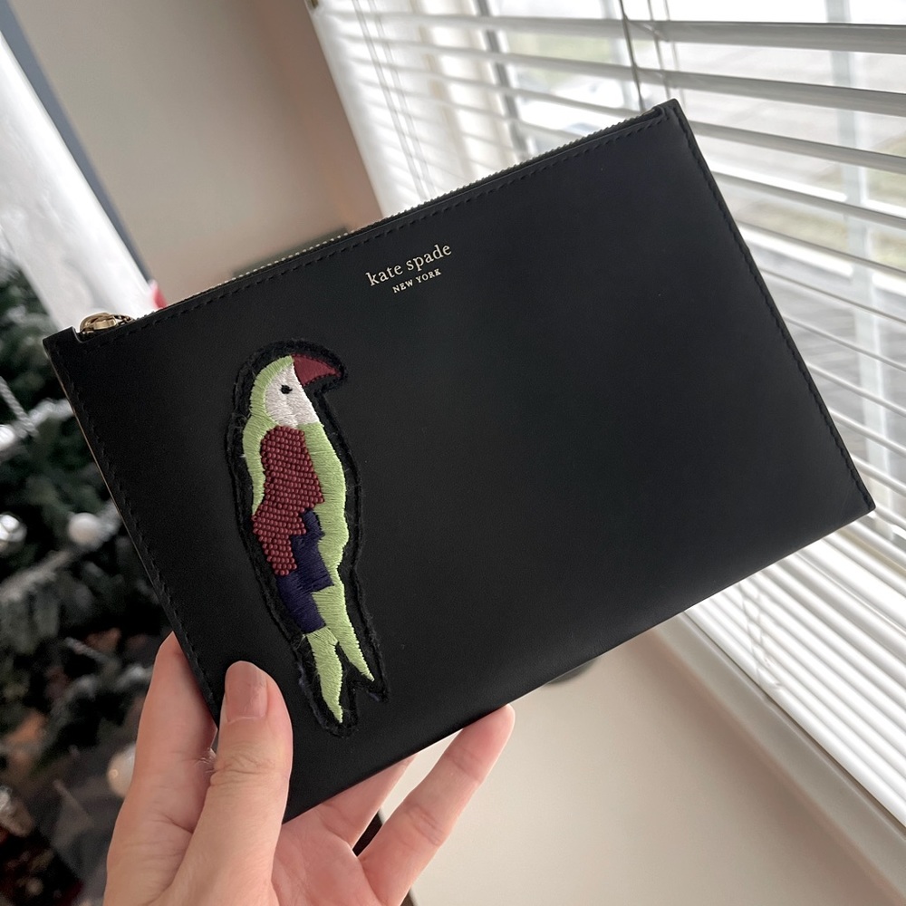 Kate Spade Retail. Parrot Wristlet in black.